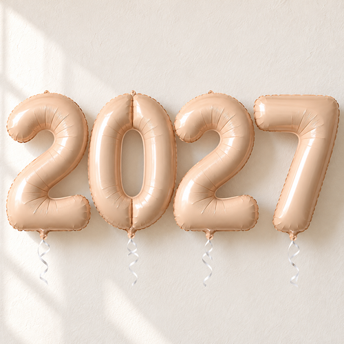 Four beige foil number balloons displaying 2027