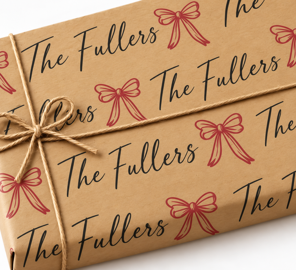 Personalized kraft gift wrap with larger red bows and family name