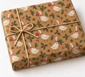 Christmas Goose Gingham Kraft Gift Wrap on a wrapped kraft gift tied with natural twine on white