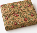 Pomegranate and Laurel Kraft Gift Wrap shown on a wrapped rectangular gift with natural twine and white background