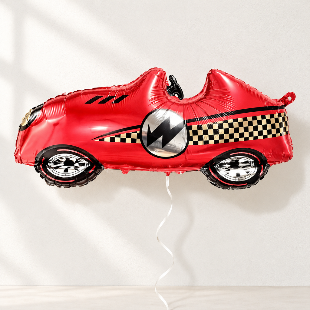 Red race-car foil balloon on a neutral backdrop