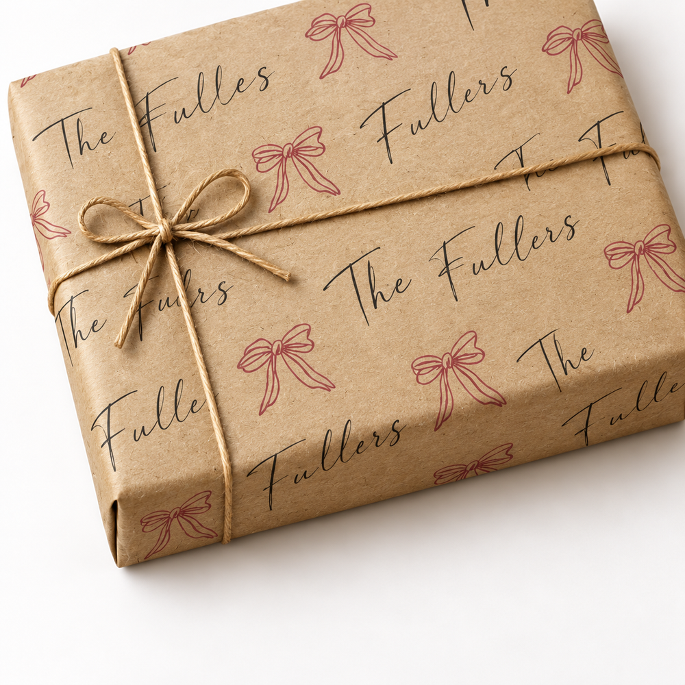 Custom Last Name Wrapping Paper on a kraft wrapped gift with jute twine