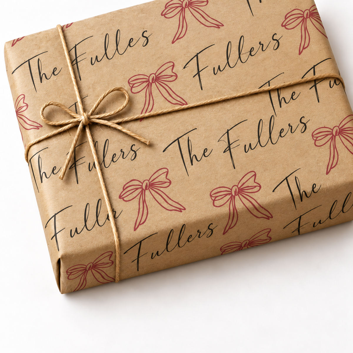 Custom Last Name Wrapping Paper on a kraft wrapped gift with jute twine