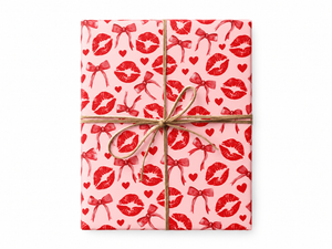 Red Kisses Hearts and Bows Wrapping Paper gift tied with twine